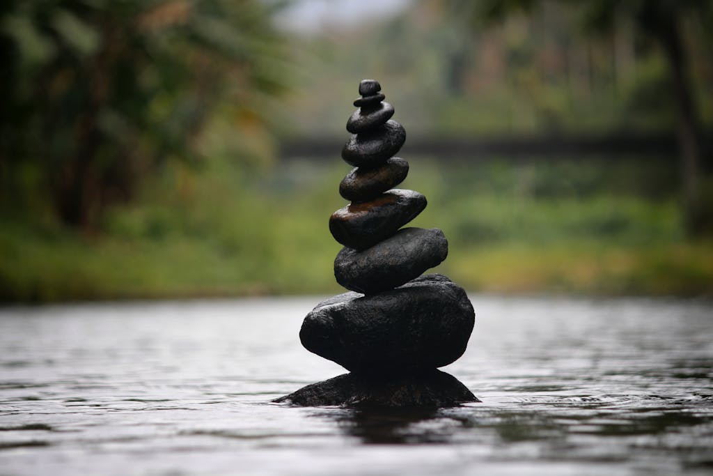 Black Stackable Stone Decor at the Body of Water